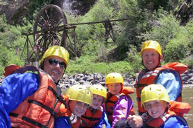 Family having fun white water rafting with Clear Creek Rafting Company near Idaho Springs, Colorado.
