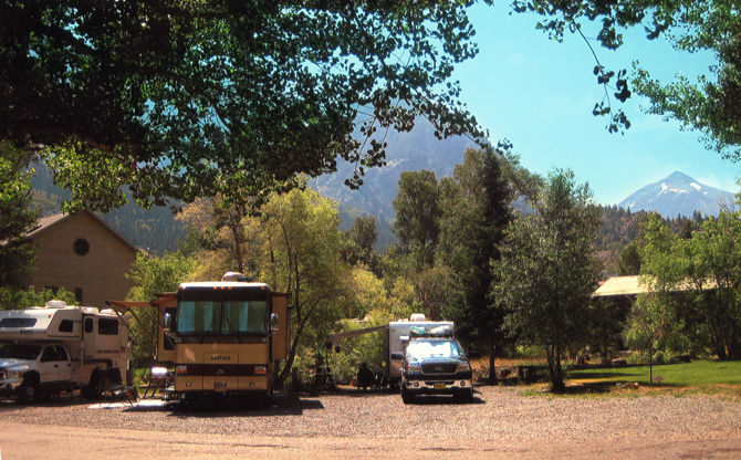 Shaded RV sites along the Uncompahgre River at 4j+1+1 RV Park & Campground in Ouray, Colorado