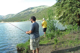 People fishing in Lake San Cristobal near Alpine Village Cabins in Lake City, Colorado.