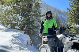 Rider posing on  Winter ATV Tour with ATV Tours Colorado in the Denver Mountains of Colorado.
