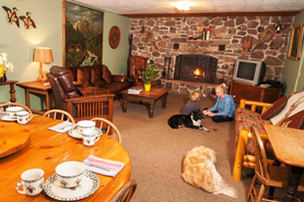 Children and Pet Dogs in Dining room at Avalanche Ranch Cabins and Hot Springs in Crystal River Valley near Glenwood Springs, Aspen, and Snowmass Village, Colorado. 3-Bedroom ranch house on 36 acres in the Crystal River Valley. Pet friendly.