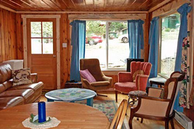 Living area inside a mountain cabin with Bear Paw Cabin and Double K Ranch in Estes Park, Colorado