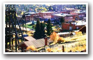 View of Victor Colorado from a hill side showing downtown and mine structure