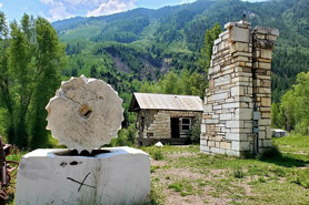 Cog and stone buildings at Historic Mill Park in Marble, Colorado.