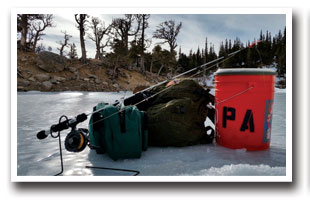 Ice fishing gear on frozen lake in Colorado