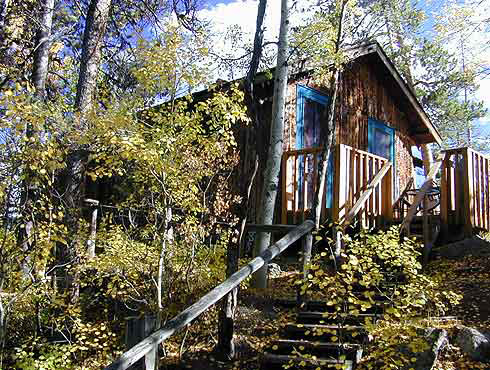Mountain Cabin and Deck at Grand Escape Cottages in Grand Lake Colorado. Vacation Cottages at End of Boardwalk. A Stone's Throw from Grand Lake. Boat and Fish.