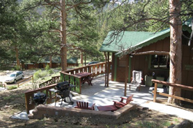 Mountain cabin with large deck at Machin's Cottages in Estes Park, Colorado