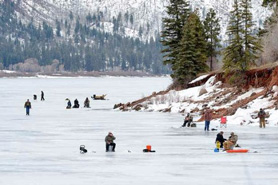 Ice fishing and sledding on Vallecito Lake in Durango, Colorado