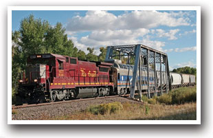 Take a Ride on The San Luis & Rio Grande Railroad engine going across a bridge