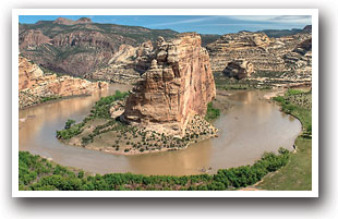 River flowing around rock formation at Dinosaur National Monument in Colorado