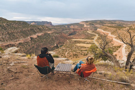 Couple enjoying view of the Uncompahgre Plateau's Redrock Canyons in Naturita, Colorado