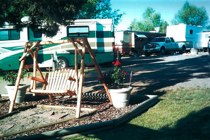 Wood bench swing at the Navajo Lake Resort RV Park and campground in Navajo Lake Colorado