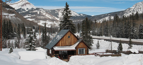The Nugget Cabin covered in a blanket of snow near Durango, Colorado