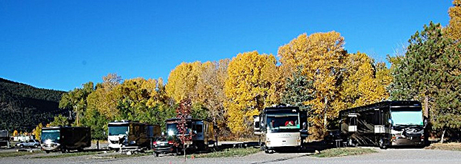 RVs lined up at the Peacock Meadows Riverside RV Park and Campground in the South Fork Area, Colorado