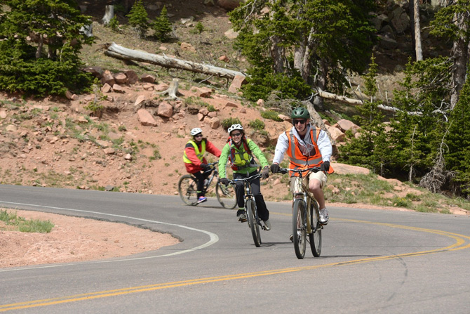 Bikers going down Pikes Peak with Pikes Peak Mountain Bike Tours near Colorado Springs, Colorado