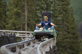 Kid riding the Rocky Mountain Coaster at Copper Mountain Resort, Colorado