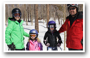 Family skiing at Granby Ranch Resort, Colorado.