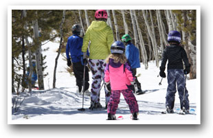Family cross country skiing at Granby Ranch Ski Resort, Colorado.