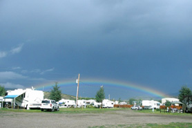 Rainbow over RV campers at South Fork Lodge, Cabins & RV Park in the South Fork area of Colorado