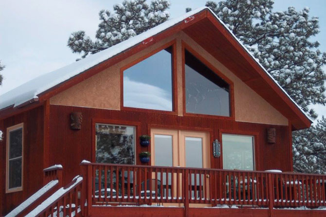 Spa Sola Fide Cabin with a coat of snow ontop in Westcliffe Colorado, A Cabin for two
