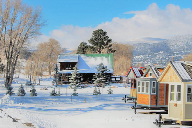 A row of cabins in the snow with Tiny Timbers Resort in South Fork, Colorado. Start a family tradition at Tiny Timbers Resort. Vacation simply with small Cabins and covered decks, surrounded by National Forest.