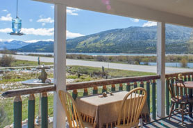 Beautiful view of Twin Glacial Lakes and mountains from the outdoor covered deck at Roadhouse Lodge and Vacation Home Rentals in Twin Lakes near Leadville and Buena Vista, Colorado.