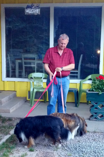 Owner with his Dogs at Wagon Wheel Cabins Resort in Lake City, Colorado