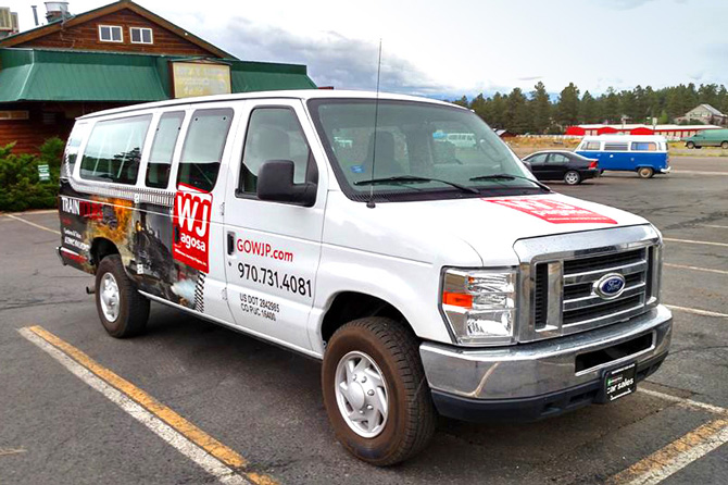 Tour Guide Shuttle Van in parking lot in Pagosa Springs, Colorado