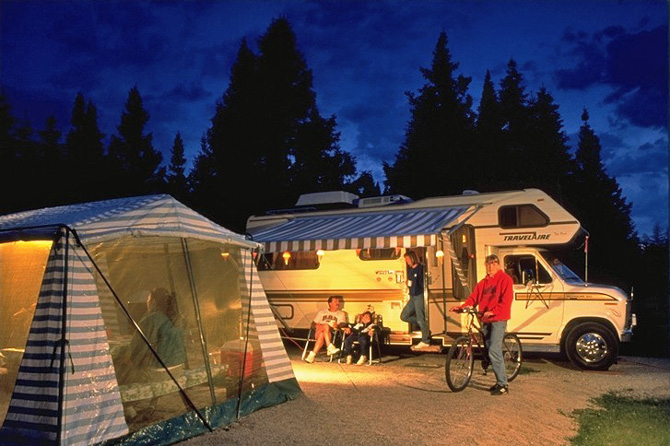 Shaded RV sites along the Uncompahgre River at 4j+1+1 RV Park and Campground in Ouray, Colorado