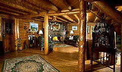 Interior of Allenspark Lodge's Great Room, rustic log furnishings in Allenspark, Colorado