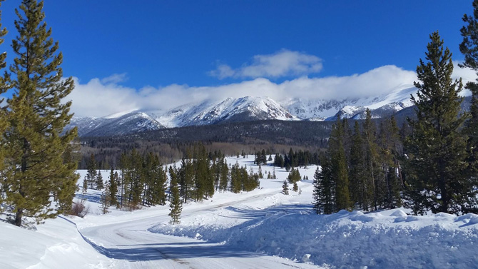 Amazing snow covered mountain view with blue skies from the Majestic Suites near North Park in Walden, Colorado