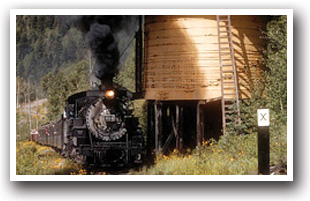 The Cumbres and Toltec Train in front of water tower, Colorado