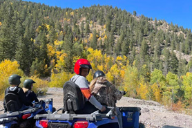 ATVing on mountain trail leaf peeping in the fall with ATV Tours Colorado near Idaho Springs, Colorado.