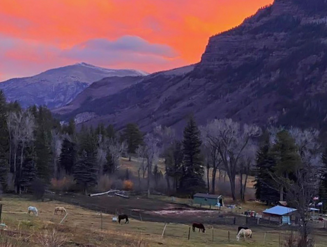 Mountain sunset over Avalanche Outfitters at Redstone Stables in Redstone, Colorado.