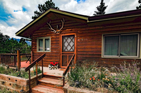 Entrance to Red Robin Log Cabin at Bear Paw Cabin and Waggin Tails Ranch in Estes Park, Colorado.