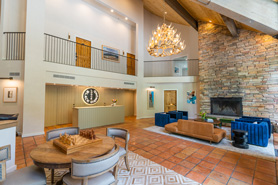 Interior view of lodge with vaulted ceilings, fireplace, and ample comfortable seating at Black Diamond Lodge located in Durango, Colorado.