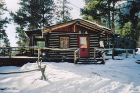 Beautiful rustic log cabin in the winter at Buckeye Cabins near Leadville, Colorado