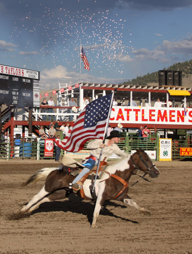 Cowgirl riding horse at Cattlemen's Days in Gunnison, Colorado