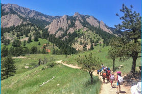Children hiking on trail by mountains at Chautauqua in Boulder, Colorado