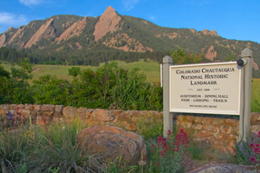 Flatirons beind Chautauqua sign at Chautauqua in Boulder, Colorado. Front door access to 40 miles of hiking trails.