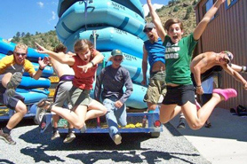 Clear Creek Rafting Company staff jumping for joy located near Royal Gorge and Idaho Springs, Colorado.