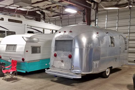 Travel trailers being repaired and renovated at Competition RV located in Denver, Colorado.