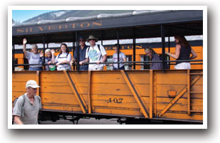 Family in railroad car near Animas River, Colorado