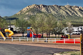 Family friendly playground and RV sites at Farmhouse RV Resort in Royal Gorge, Colorado