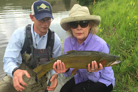 Woman holding a large trout near Lake City, Colorado