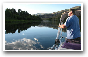 Man on boat fishing Green Mountain Reservoir near Heeney, Kremmling and Parshall, Colorado