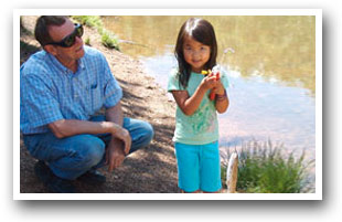 Girl catching a fish in Colorado