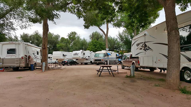 Large pull-thru RV sites with picnic tables and full hook-ups at Fountain RV Park in Colorado Springs, Colorado.