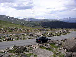 Car parked along Mount Blue Sky Scenic Byway, formally Mount Evans Scenic Byway, Colorado.)
