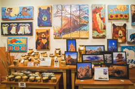 Big wall and tables full of local art at Garden of the Gods Trading Post, Gift Shop, and Art Gallery in Manitou Springs, Colorado